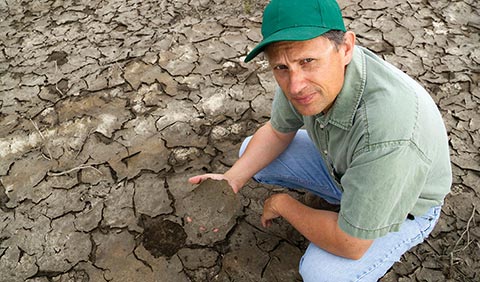 man holding soil